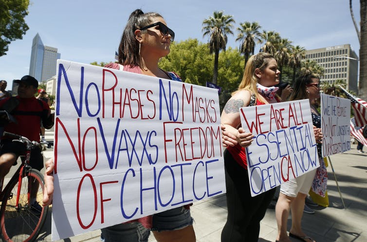 Coronavirus Conspiracy Theories and Reopen Protests as Death Denial