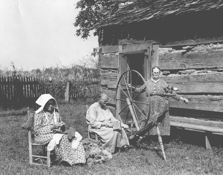 Three mountain women near Spencer, Tenn., spinning, carding and knitting